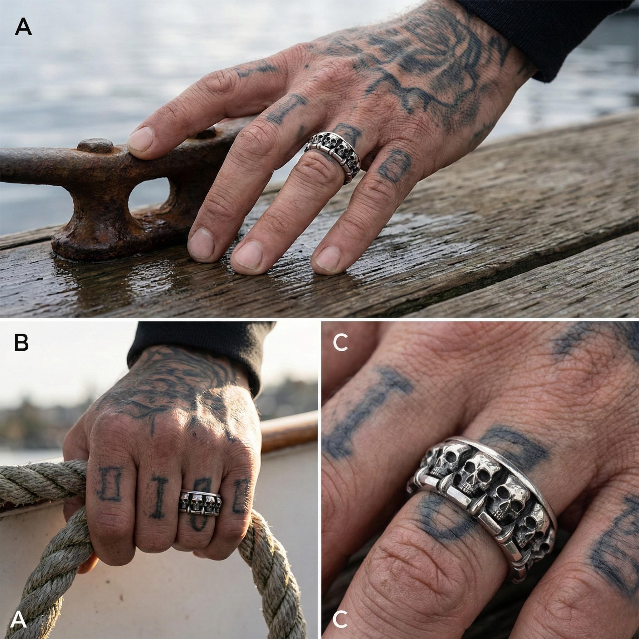 A person's hand with tattoos and a ring featuring skull designs.