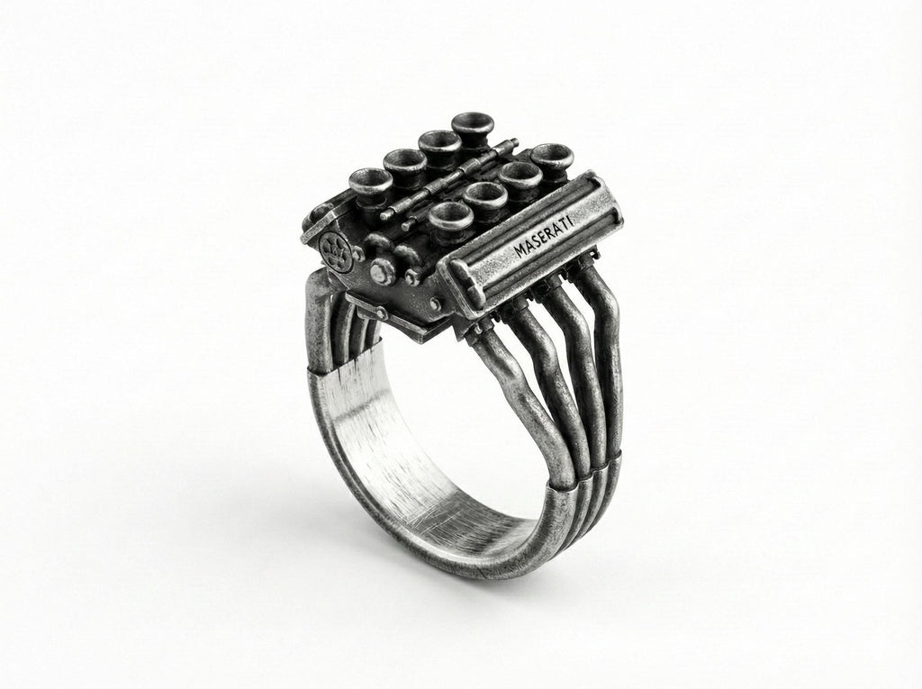 A ring with a metal engine design, featuring multiple pipes and components.